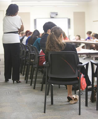 instructor-and-college-students-in-room