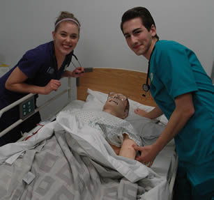 nurse-aides-practicing-on-simulator-dummy