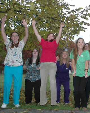 nursing-assistants-jumping-outside