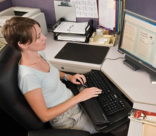 woman-reclining-reading-computer-screen