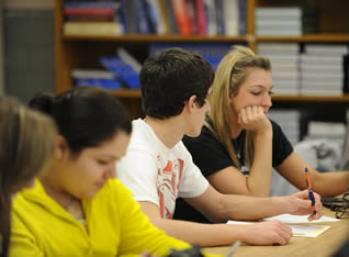 college-students-at-desk-in-class