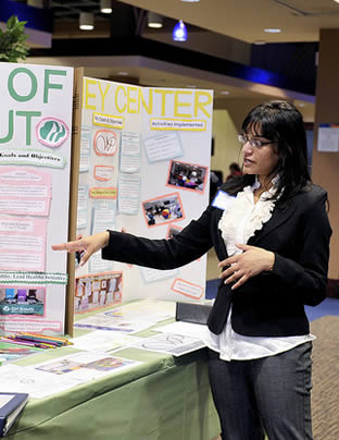 school-employee-at-sign-up-display