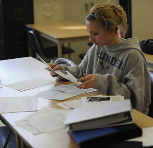 college-student-blonde-girl-at-desk