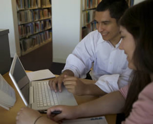 hispanic-students-working-on-laptop