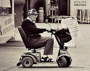 old-man-on-mobility-scooter-5500303