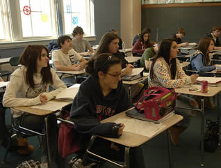 students-at-desks-in-class
