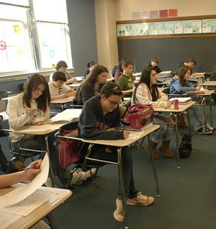 students-in-classroom-at-desk