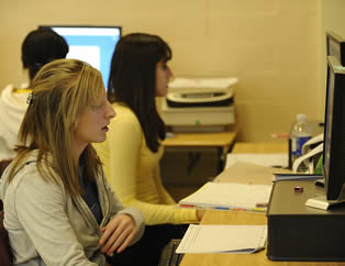 students-working-on-computer-in-class