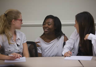 three-college-student-women-in-class