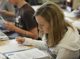 young-female-college-girl-in-class