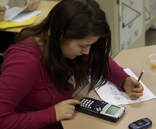 young-female-student-using-calculator