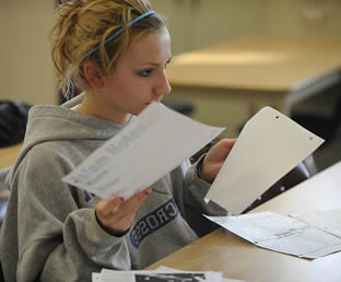 young-woman-college-student-with-papers