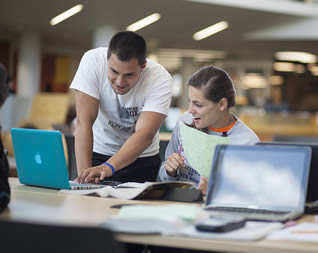 college-students-using-apple-laptop