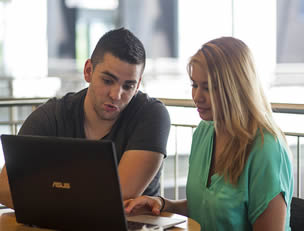 college-students-using-laptop-at-school