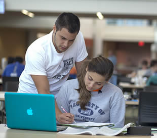 college-students-working-on-assignment-at-school