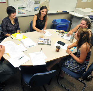 female-college-students-discussing-class