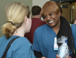 nurses-talking-at-company-meeting