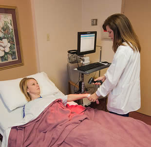 licensed-practical-nurse-scanning-patient