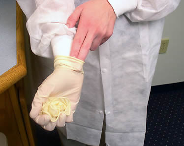 nurse-aide-removing-safety-gear