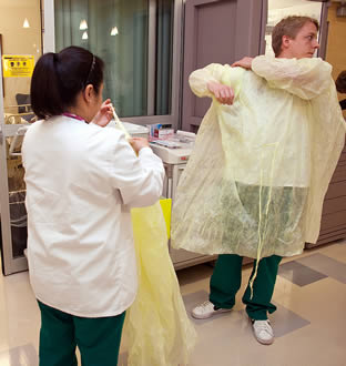 nurses-donning-protective-gear