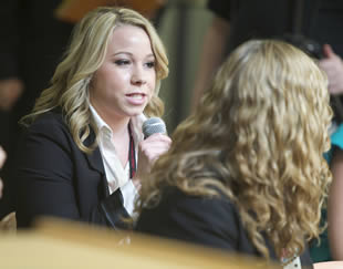 blond-female-college-student-speaking-to-class