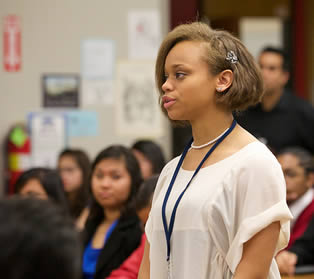 college-student-speaking-in-class