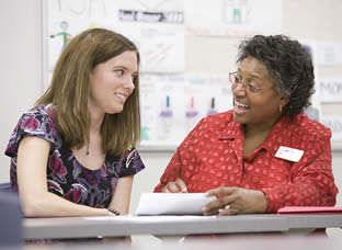 college-student-talking-to-instructor