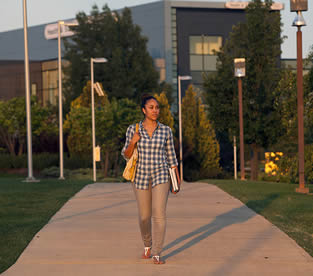 college-woman-walking-on-campus