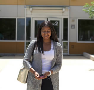 student-walking-on-college-campus