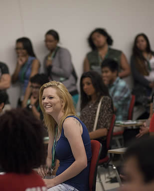 students-sitting-and-standing-in-college-class