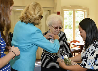 nurse-aide-working-with-elderly-at-event