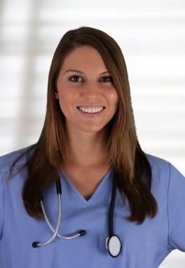 Nursing assistant in scrubs at work