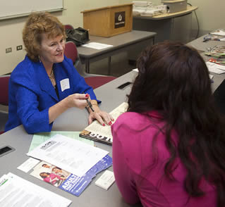 college-instructor-speaking-to-student