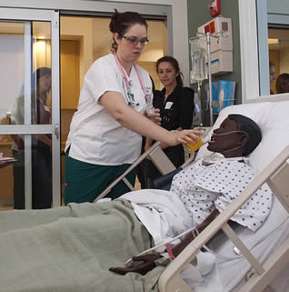 nurse-demonstrating-feeding-patient