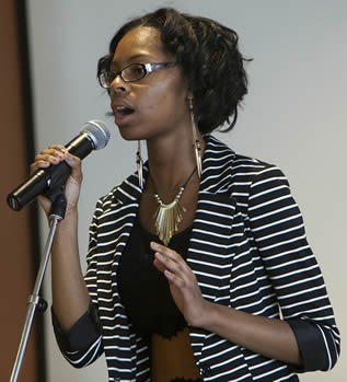 student-speaking-in-college-classroom