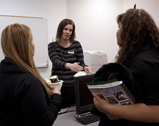 students-speaking-to-college-instructor