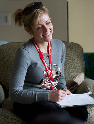 blonde-female-student-taking-notes