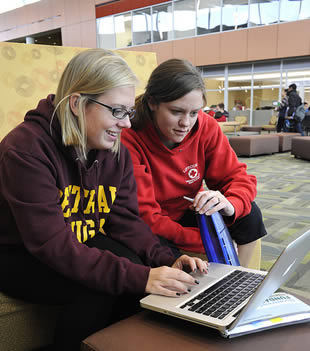 college-student-girls-looking-at-laptop