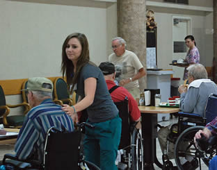 nurse-aide-helping-elderly-man