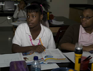 students-in-classroom-listening-to-teacher