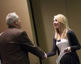 young-female-college-student-shaking-hands