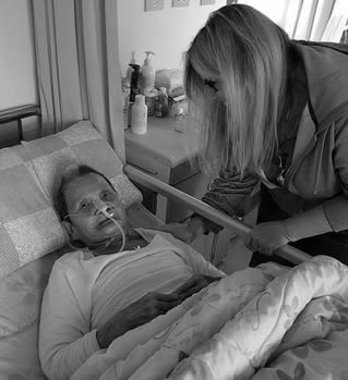 nursing-home-resident-in-bed-0111