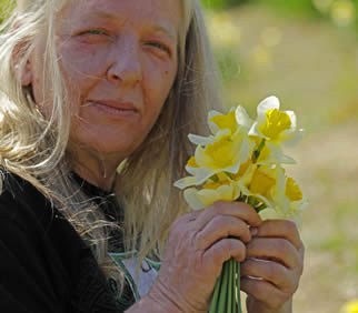 older-woman-picking-flowers-5503