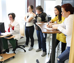 teacher-demonstrating-instruction-to-nurse-aides