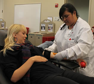 certified-nursing-assistant-taking-blood-pressure