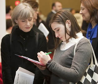 young-college-girl-writing-on-clipboard