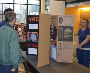 medical-student-explaining-health-care-during-event