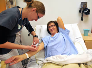 CNA training on the job with patient