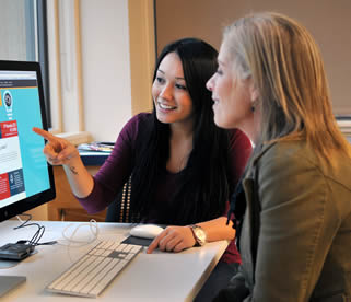 college-girl-pointing-to-computer