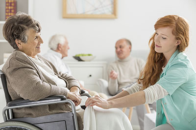 Nurse with patient in wheelchair